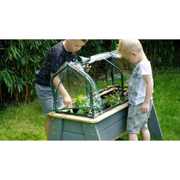 Table jardinière en bois avec serre et outils de jardinage